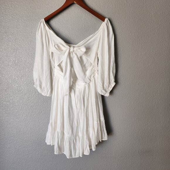 Saints + Secrets Puff Sleeve Open Back Bow White Ruffle Dress - Picture 8 of 9